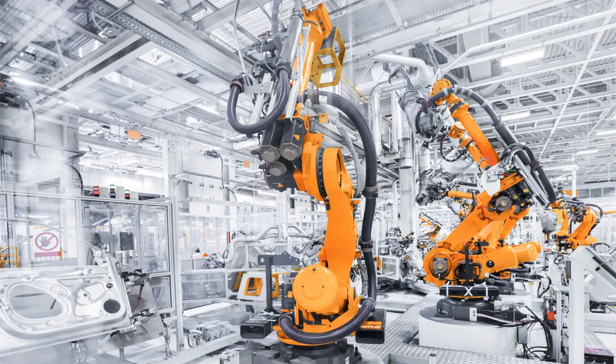 Factory floor with industrial robots on an automated production line